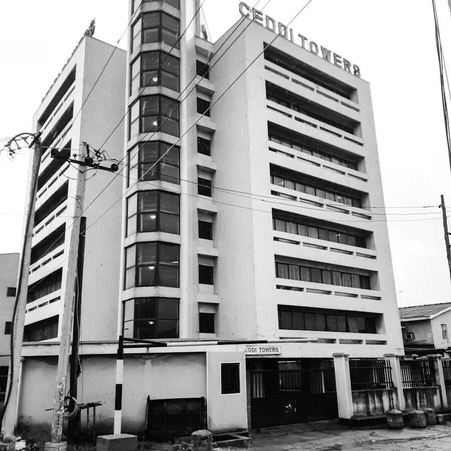 Photo by Muhammed A. Mustapha greyscale photo of Ceddi Towers building